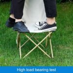 Two users standing on sturdy camping chair.