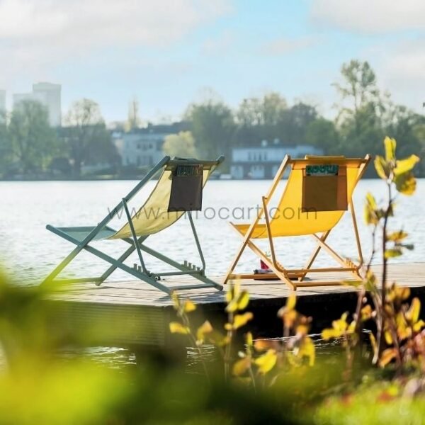 Matching foldable sun loungers surrounded by nature with storage pockets visible.