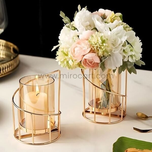 Golden pillar candle holders surrounded by peonies and greenery for wedding styling.