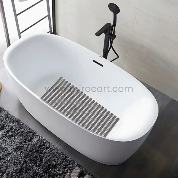 Close-up of a textured non-slip bathroom mat inside a bathtub, highlighting its durable and slip-resistant surface.