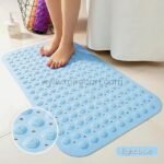 Close-up of a light blue non-slip bathtub mat showing textured bumps that enhance grip.