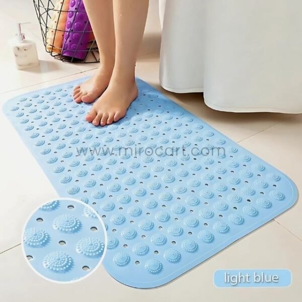 Close-up of a light blue non-slip bathtub mat showing textured bumps that enhance grip.