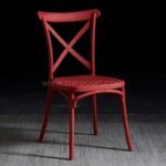 Vibrant red cross-back chair making a dramatic style statement.