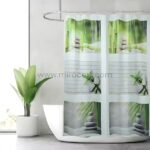 Modern zen shower curtain with soft bamboo and stacked stone patterns, styled in a minimalist, sunlit bathroom.