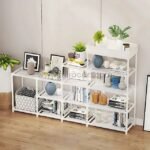 A white multi-tier storage rack filled with books, decor, and plants, creating a cozy and organized living space.