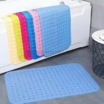 Multiple colored non-slip bathtub mats in shades of blue, purple, pink, and yellow.