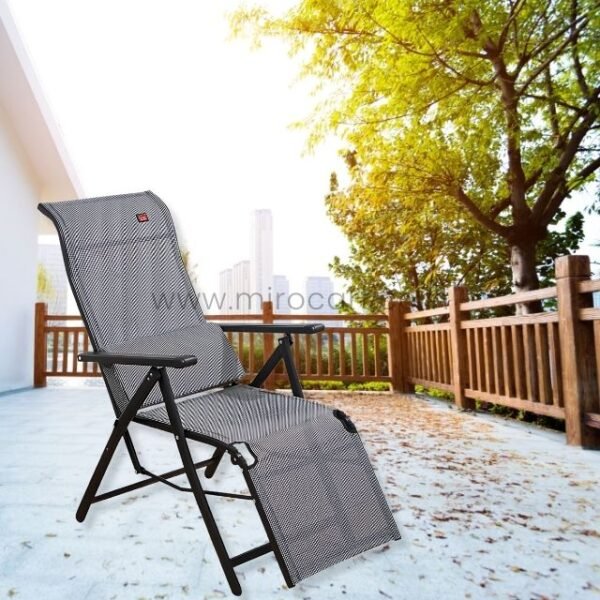 A premium zero-gravity lounge chair set outside on a deck, surrounded by sunlight and natural scenery.