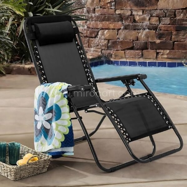 A zero-gravity lounger styled with a striped towel and a woven drink caddy, ready for a day of indulgence.