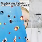 A child peeking behind an underwater-themed shower curtain, highlighting its non-toxic material.