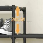 The black shoe rack features adjustable layers with a height of 20 cm, providing flexibility for different shoe sizes.