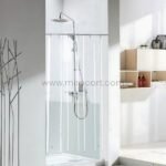 Transparent shower curtain in a minimalist walk-in shower with white tiles.