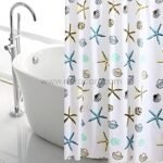 Starfish shower curtain with vibrant starfish and seashell designs in a luxurious bathroom with a freestanding bathtub.