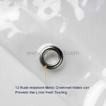 Close-up of durable, rust-resistant grommets on a transparent curtain.