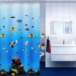 Close-up of an underwater-themed shower curtain showing detailed fish and coral artwork.