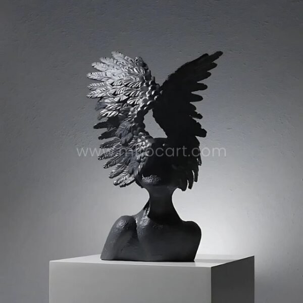 Celestial Winged Angel Sculpture in black, standing out with bold contrast in a modern setting.