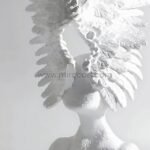 Celestial Winged Angel Sculpture glowing in bright light, showcasing crisp lines and expansive wings.