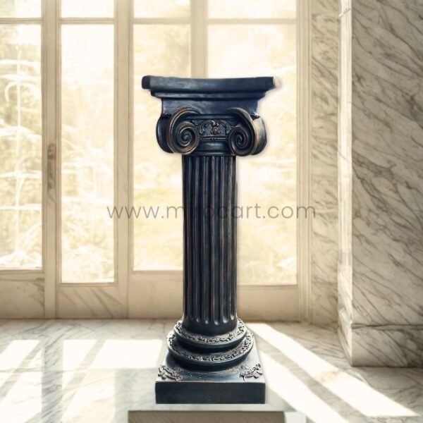 A sleek, dark-colored classical Roman pillar stands elegantly in a sunlit modern home with marble walls and large windows.