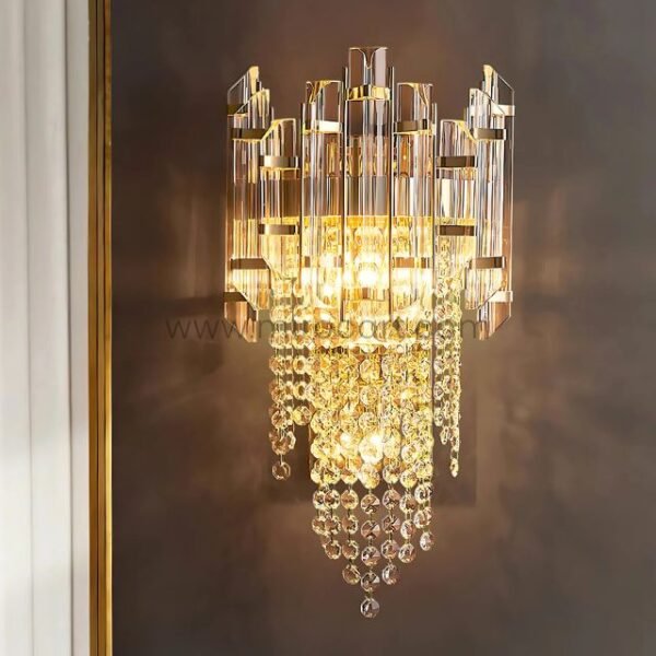 Crystal Cascade Wall Light filling a cozy room with golden ambiance and soft textures.