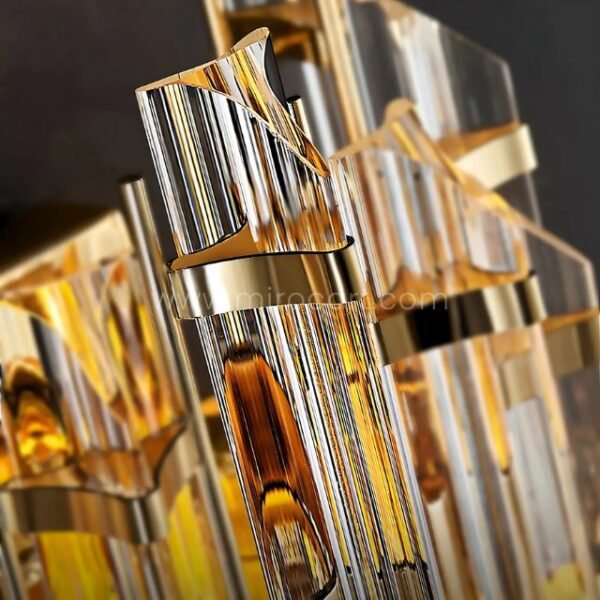 Elegant gold and crystal framework of the Crystal Cascade Wall Light in detail.