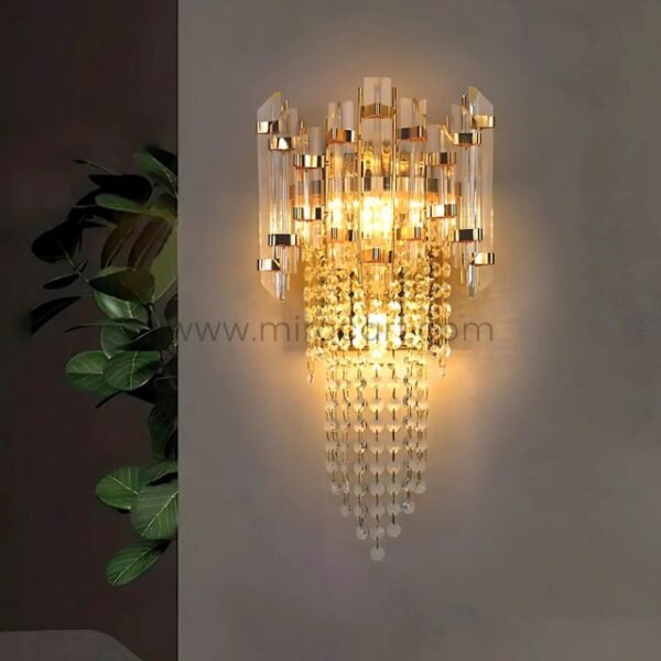 Crystal Cascade Wall Light beaming softly beside vibrant indoor plants for a luxe-natural vibe.