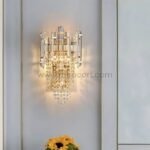 Crystal Cascade Wall Light shining in a bright minimalist room with soft hues and a sunflower pop.