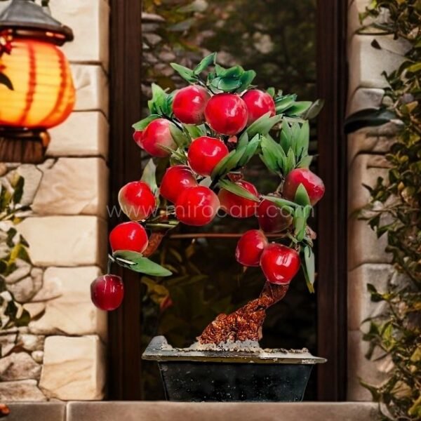 Graceful Chinese apple tree placed outdoors on a stone base beside traditional garden tiles, with red lanterns hanging nearby.