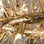 Detailed look at the chandelier’s gold frame structure.