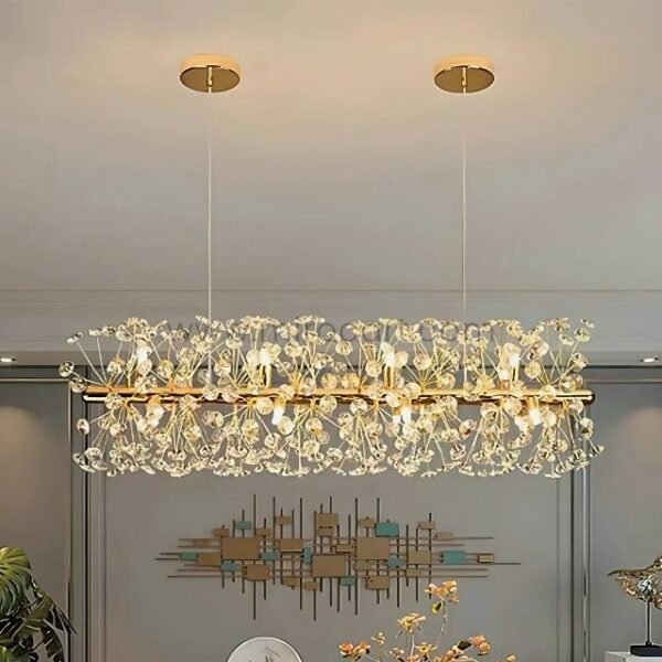 Luxury gold bar chandelier above a modern living room with artful wall decor.