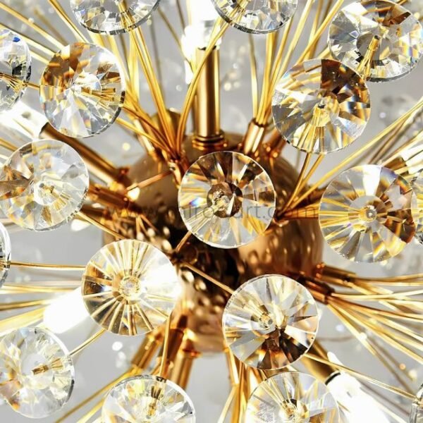 Detailed view of the gold bar chandelier’s shimmering crystal elements.