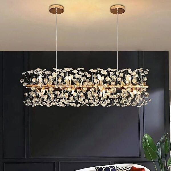 Luxury gold bar chandelier glowing against matte black wall panels.