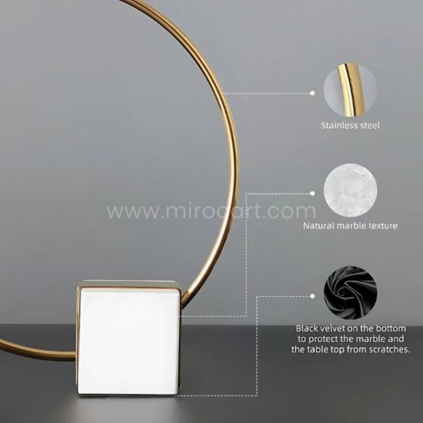 Stainless steel ring, marble base, and velvet underlayer of sculpture.