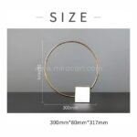 Dimensions of the Minimalist Golden Ring Sculpture: 300mm W x 80mm D x 317mm H.