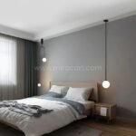 Single black modern arc pendant light in a minimalist bedroom setup.