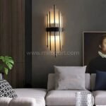 Modern Cascade Wall Light casting ambient glow in a contemporary living room.