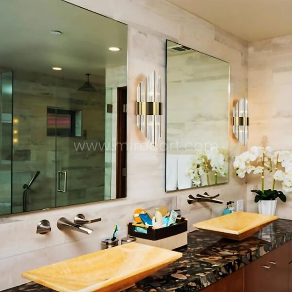 Modern Cascade Wall Lights flanking a mirror in a luxe, spa-inspired bathroom.