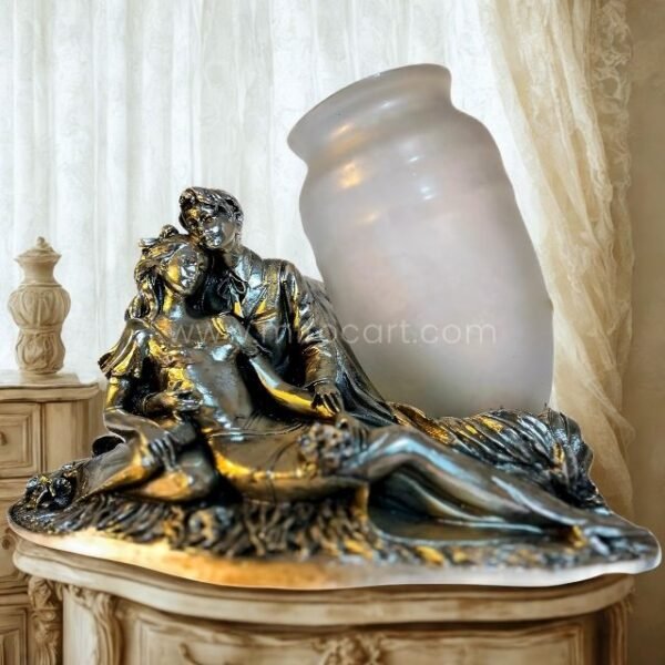Silver sculpted lovers figurine with opaline glass vase resting on a dark wooden console table in a vintage-style living room.