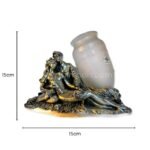 Silver-toned sculpted lovers figurine with opaline glass vase shown with measurements: 15cm x 15cm.