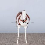 Frontal view of Shattered Ride sculpture highlighting its twisted legs and expressive stance.