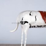 Rear perspective of Shattered Ride sculpture, revealing the flowing tail and burdened form.