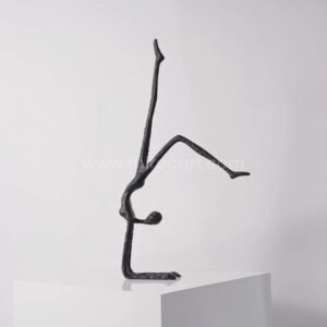 Stillness in Motion Sculpture – Abstract Black Metal Handstand Figure for Modern Spaces
