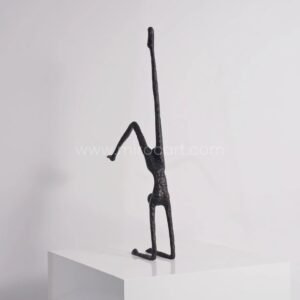 Stillness in Motion Sculpture – Abstract Black Metal Handstand Figure for Modern Spaces