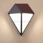 Diamond wall light on a plain wall, featuring clean geometric design and warm, soft LED lighting.