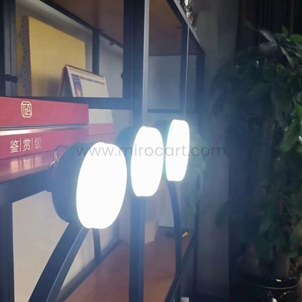 Rechargeable LED Camping Lantern lighting up a cozy indoor room.