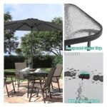 Modern outdoor table with tempered glass top and central parasol hole.