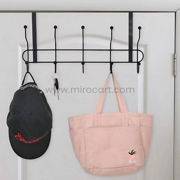 Over-the-door hook rack holding a cap and tote bag on a door.