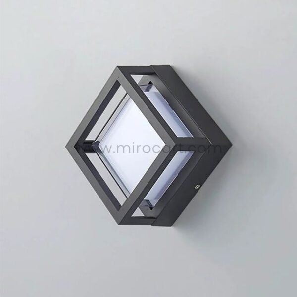 Sleek cube wall light on white minimalist background showing clean design.