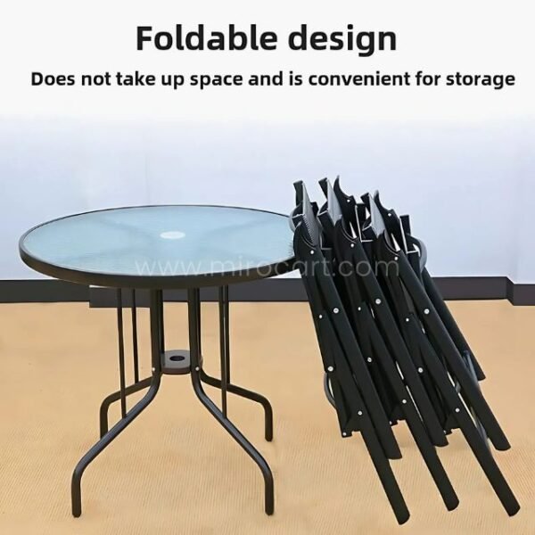 Foldable modern outdoor table and chairs stored neatly against a wall.