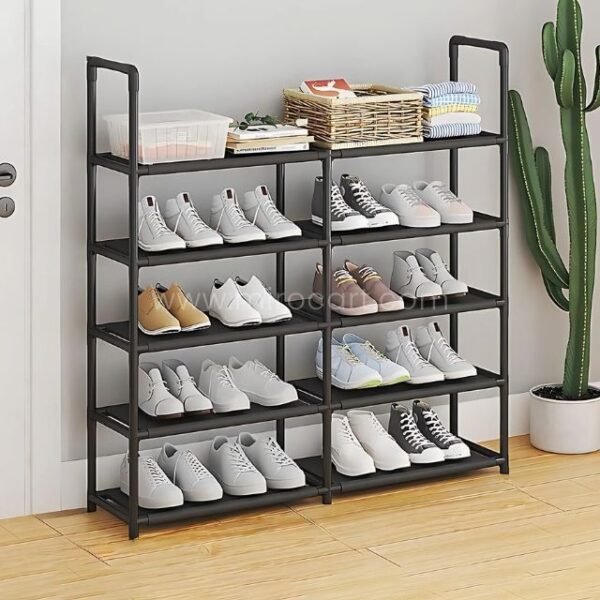 A spacious multi-shelf shoe organizer in sleek black, seamlessly integrated into a modern home with shoes, baskets, and folded clothes stored on top.