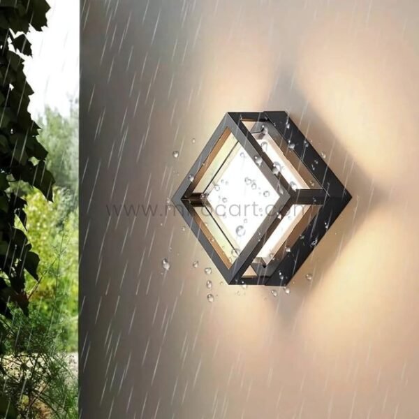 IP65 waterproof sleek cube wall light glowing in heavy rain.