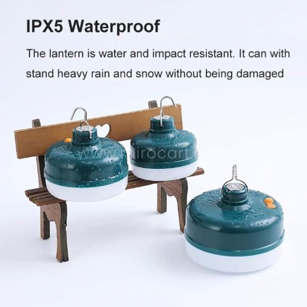 Three Rechargeable LED Camping Lanterns with water droplets, showing waterproof performance.